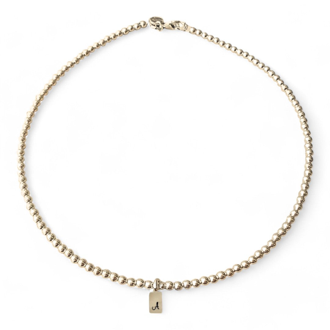 Ketting gouden kralen met letter