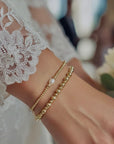 Gouden armband met 2 en 3mm kralen