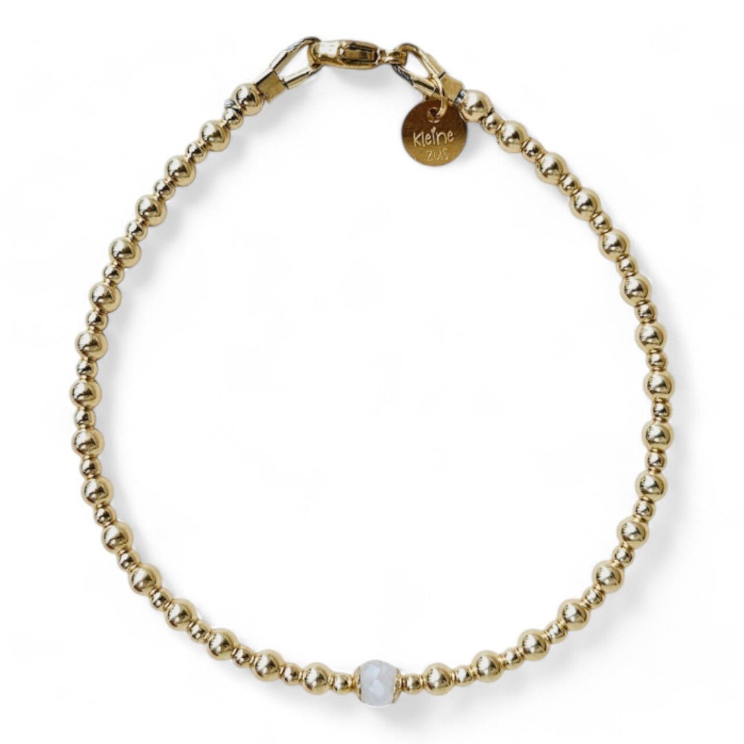 Gouden dames armband met 2 en 3 mm gouden kraaltjes met in het midden een geboortesteen
