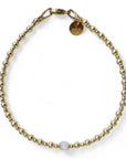 Gouden dames armband met 2 en 3 mm gouden kraaltjes met in het midden een geboortesteen