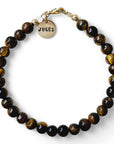 Armband heren goud Ian met 6mm natuursteenkralen Tijgeroog, aan de sluiting hangt een gouden naambedel