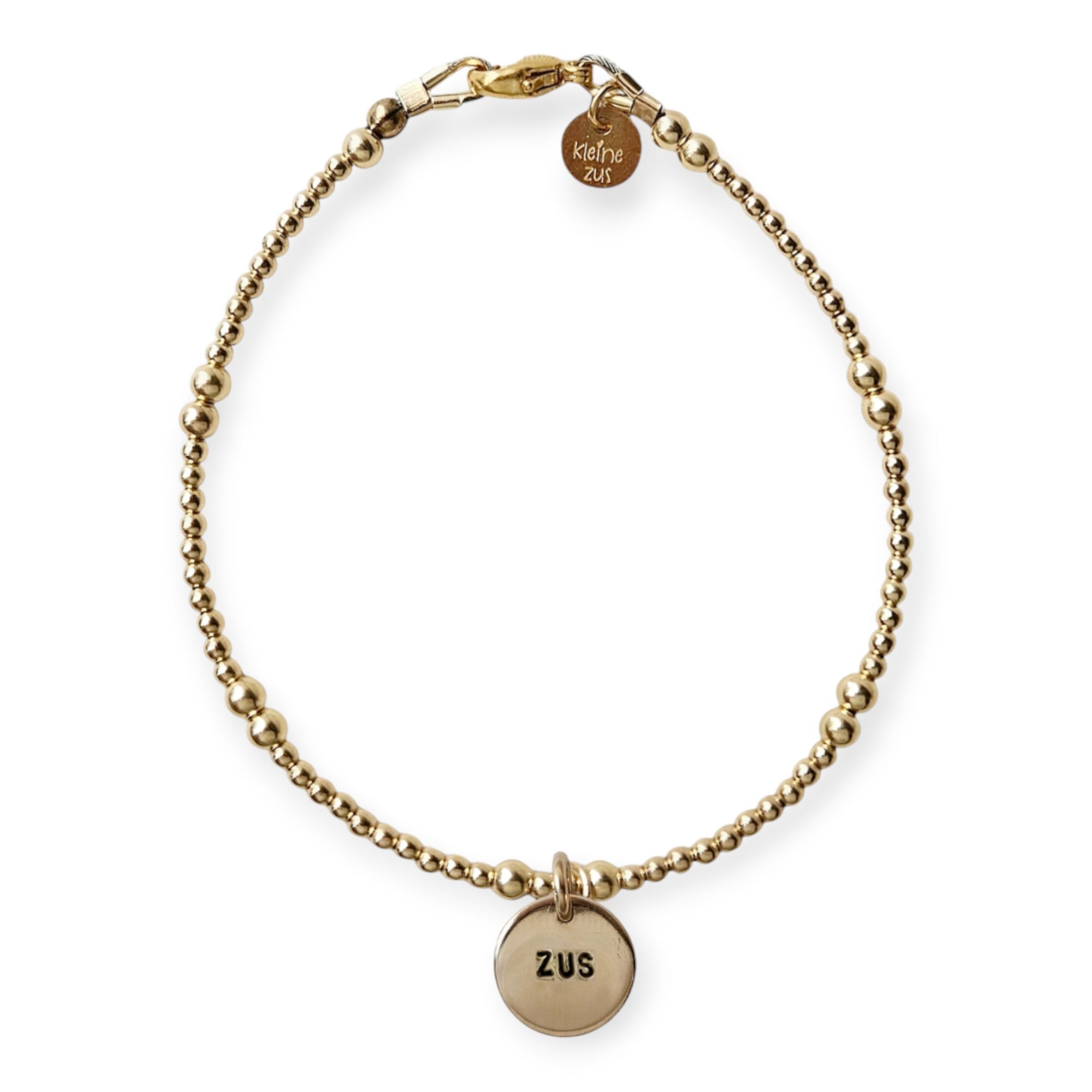 Armband met naam dames goud Pip
2mm gouden kraaltjes afgewisseld met 3mm, in het midden van de armband hangt een gouden naambedel van 10mm