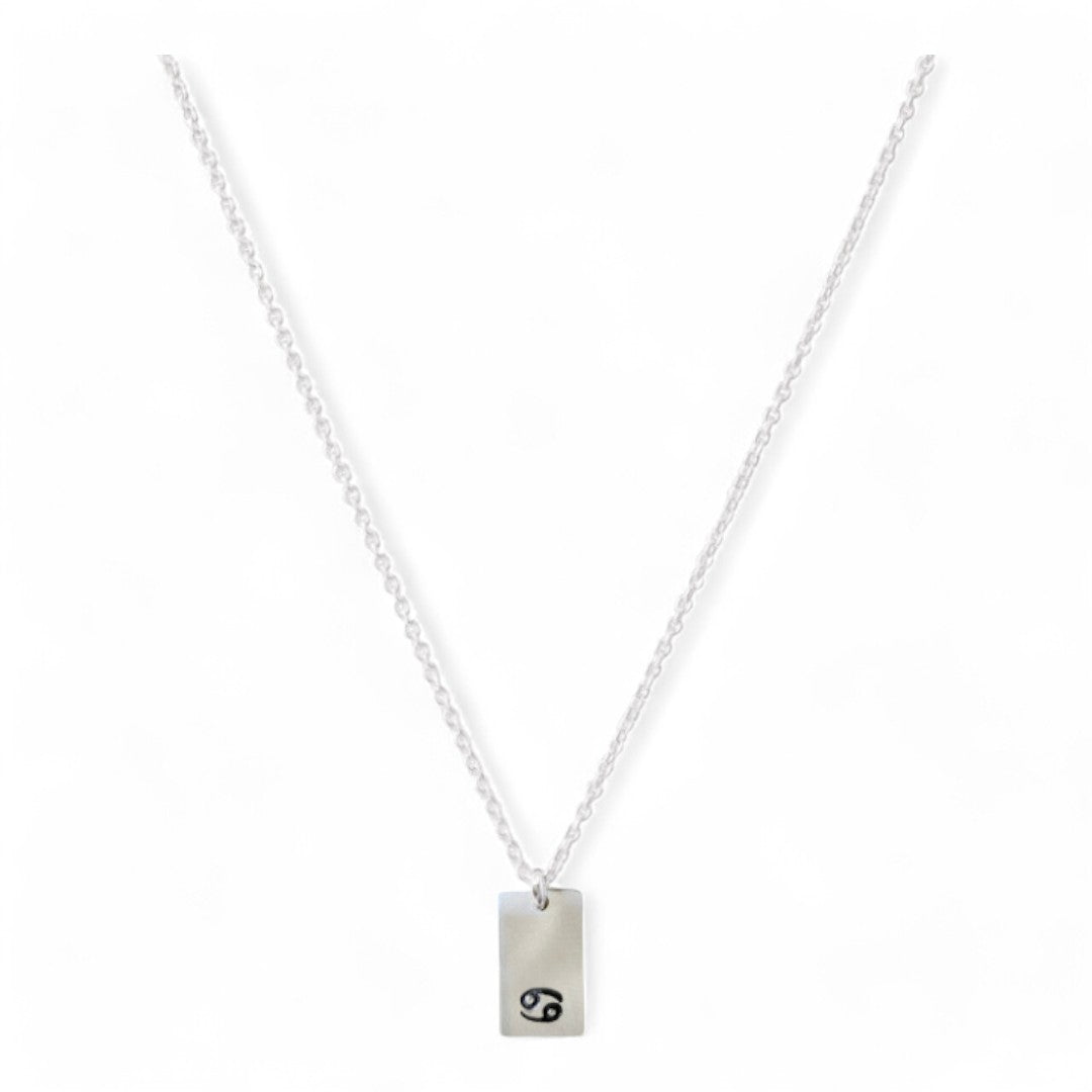 Zilveren dames ketting , aan de ketting hangt een zilveren tag waar een sterrenbeeld op gestempeld kan worden