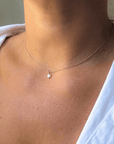 Gouden dames ketting, aan de ketting hangt een gouden geboortesteen van 4mm