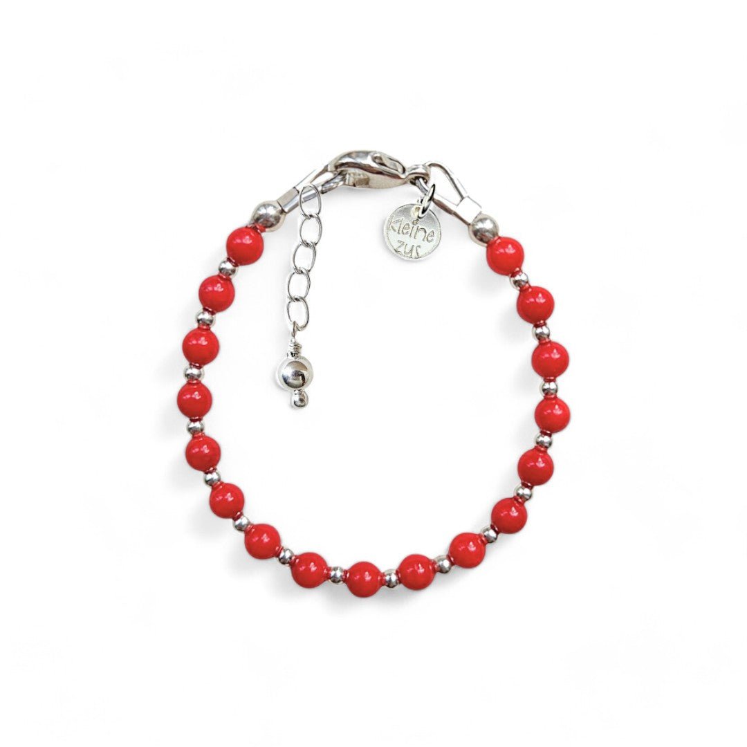Zilveren babyarmbandje Lauren gemaakt van 2mm kraaltjes gecombineerd met bloedkoraal