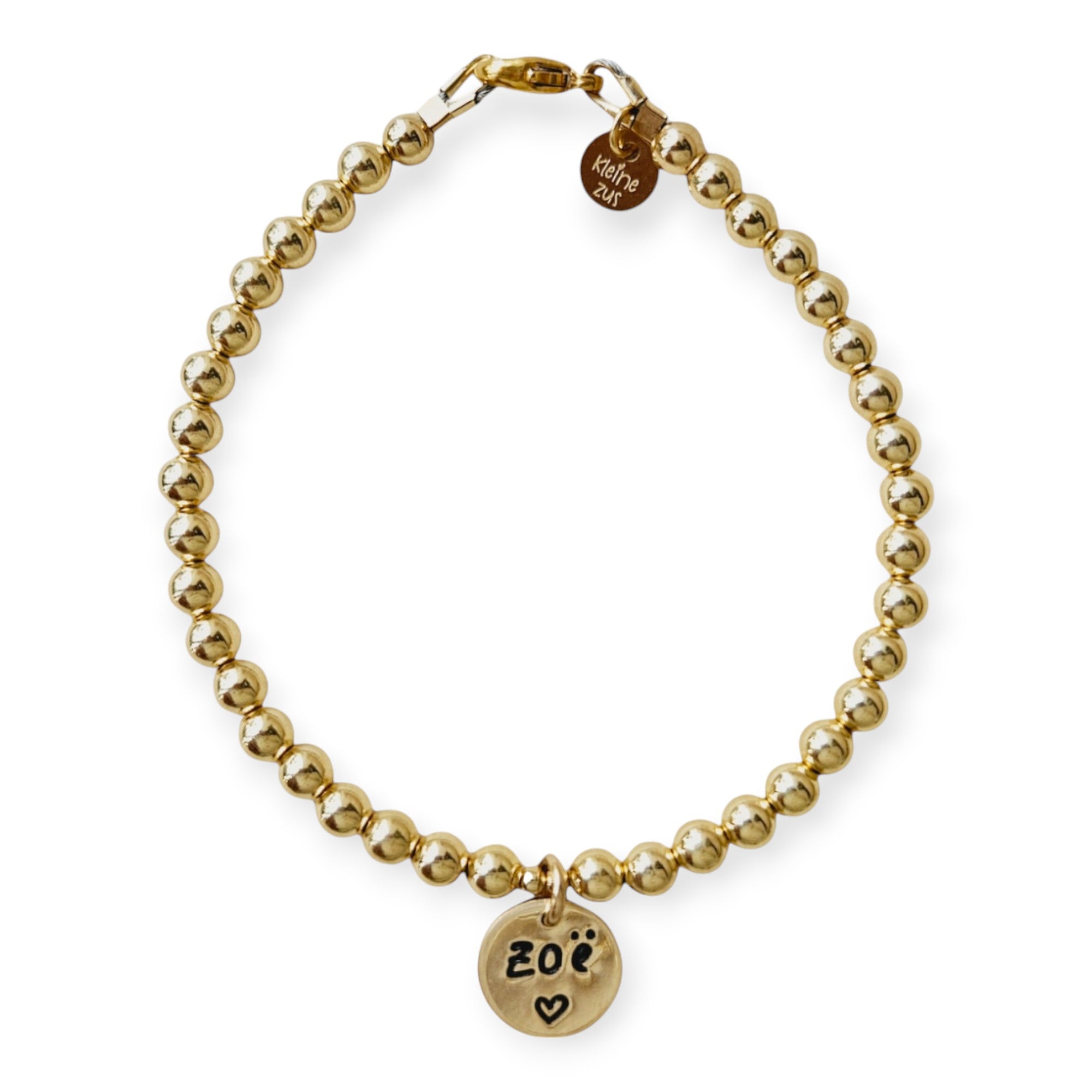 Armband met naam dames goud Jill
4mm gouden kraaltjes, in het midden hangt een gouden naambedel van 10mm